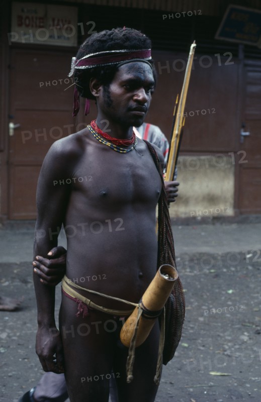 INDONESIA, Irian Jaya, Baliem Valley, Wamena.  Dani warrior wearing penis gourd.