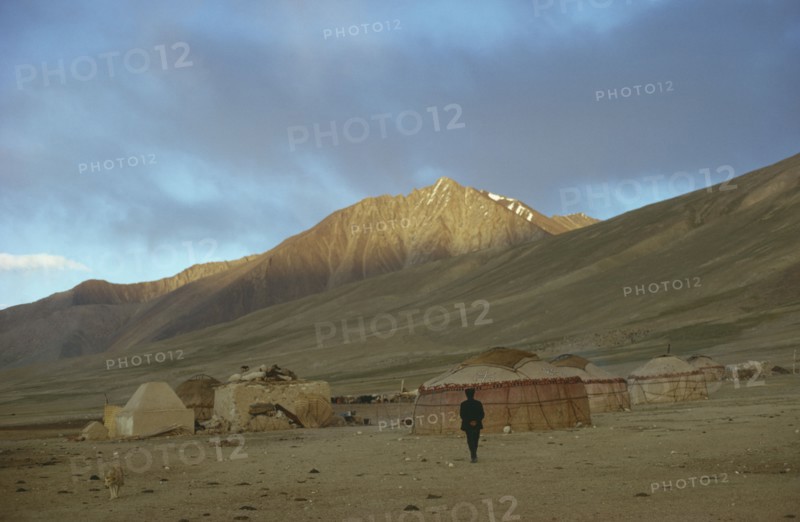 AFGHANISTAN, Traditional Homes, Kirghiz yurts in bleak mountain landscape.