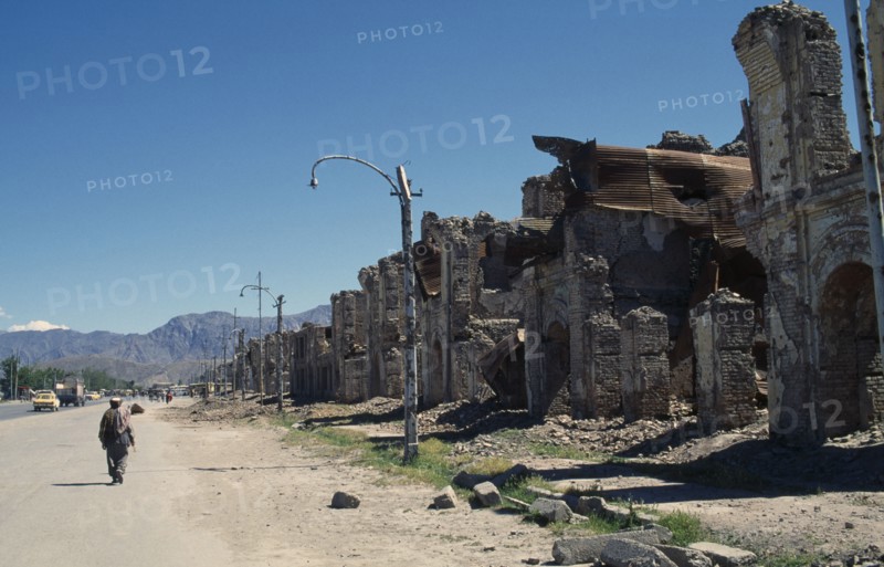 AFGHANISTAN, Kabul, Badly damaged housing lining street.
