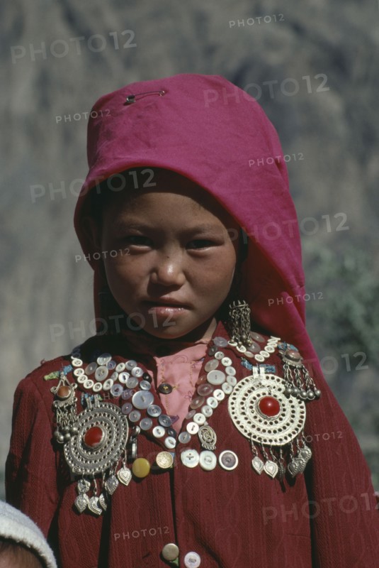 AFGHANISTAN, Nomadic People, Head and shoulders portrait of young Kirghiz girl.