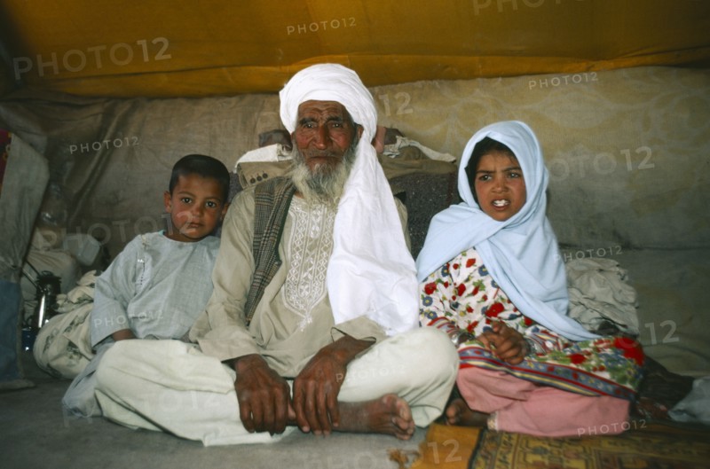 AFGHANISTAN, Nomadic LIfestyle, Portrait of nomad family in their tent.