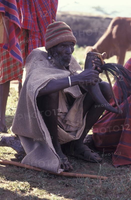 KENYA, Kajiado, Gourds filled with honey beer are drunk at the beginning of the an initiation ceremony that will bring the young Maasai Moran or young warriors into manhood.