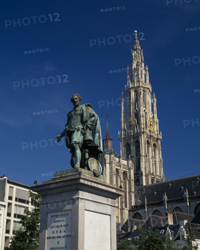BELGIUM, Flemish Region, Antwerp, Cathedral of Notre Dame with statue of the seventeenth century artist Peter Paul Rubens in the foreground