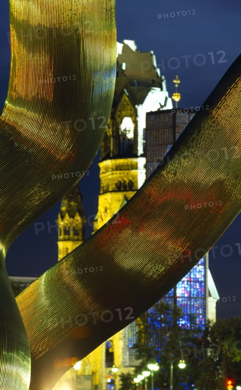 GERMANY, Berlin, Detail of illuminated wavy metal sculpture entitled Berlin with the Kaiser Wilhelm Gedachtniskirche behind