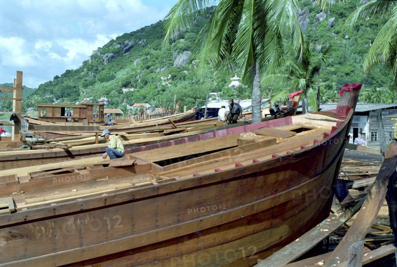 VIETNAM, South, Nha Trang, Building a new fishing fleet with half built wooden ships in the foreground