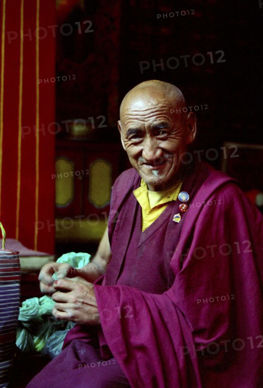 INDIA, Sikkim, Rumtek Gompa, Portrait of monk performing Pujar ceremony  and the making of a spiritual Mandala