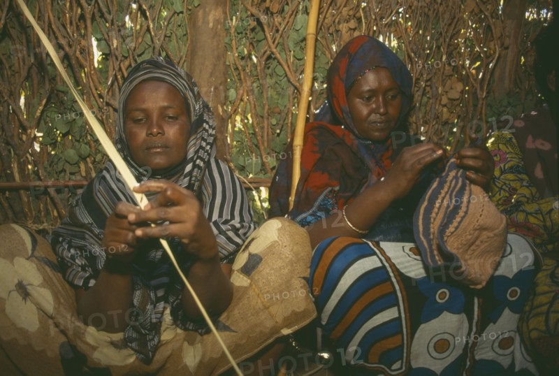 KENYA, Tribal Peoples, Local women making clothing.