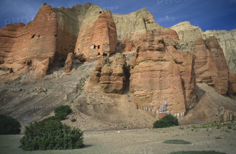 NEPAL, Mustang, The red cliffs of Drakhmar with Buddhist shrine at the base