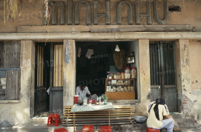 VIETNAM, North, Hanoi, Street cafe with customers.
