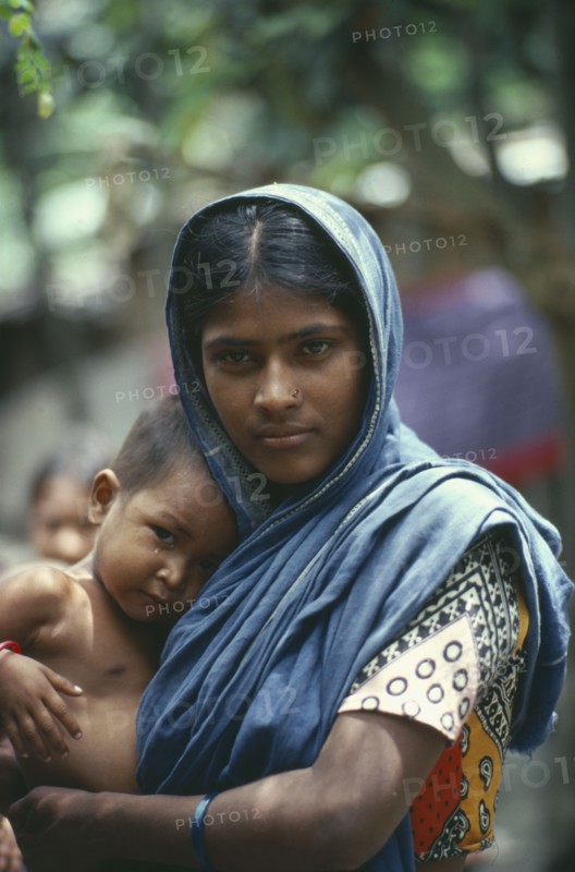 BANGLADESH, Family, Young mother holding baby.