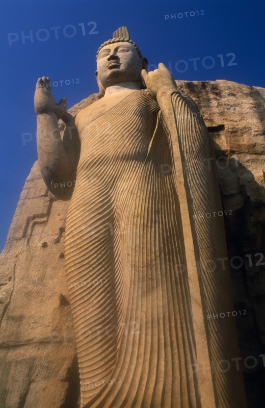 SRI LANKA, Aukana, Twelve metre high standing Buddha believed to have been sculpted during the reign of Dhatusena in the 5th century AD.