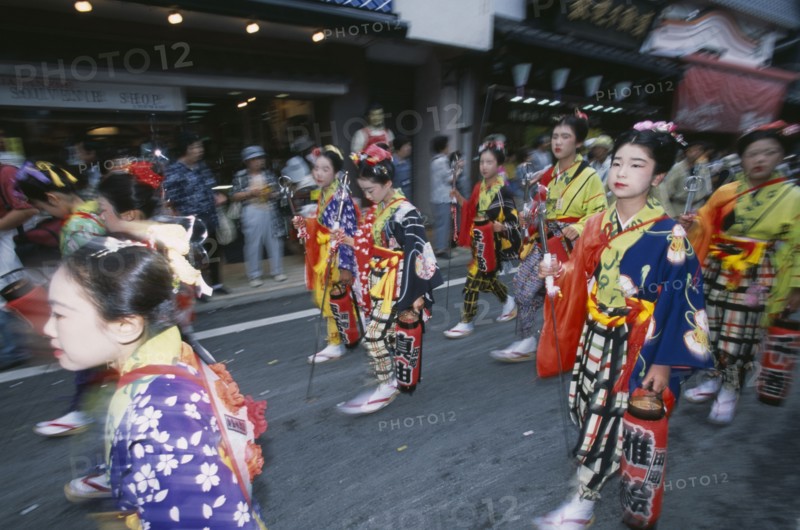 JAPAN, Chiba, Narita, Festival procession with young girls wearing traditional kimonos during the July Gion Matsuri