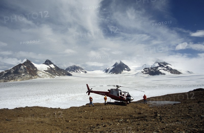 USA, Alaska, Near Skagway, Landed helicopter on rocky ground near Juneau icefield