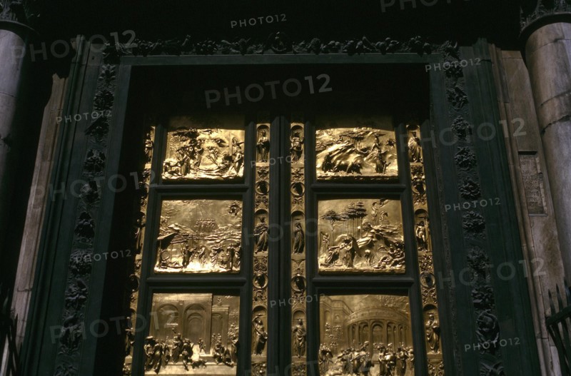 ITALY, Tuscany , Florence, Close up of black wooden Baptistry door of the Duomo with pannels of carved gold depicting stories from the Old Testament