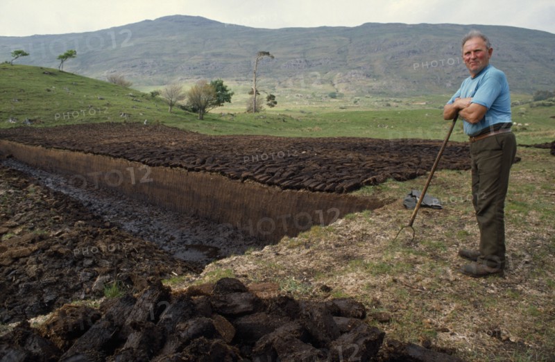 IRELAND, County Mayo, Farming, Peat cutter.