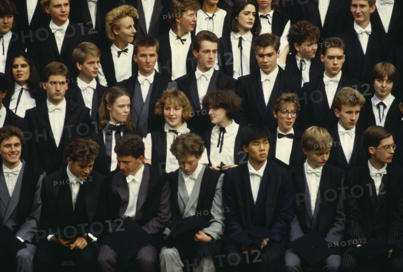 ENGLAND, Oxfordshire, Oxford University, First year students at University College pose for a college photograph in front of the main building