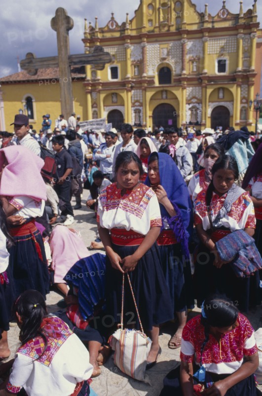 MEXICO, Chiapas, San Cristobal de las Casas, Zapatista demonstration with indigenous indian people gathered outside yellow building