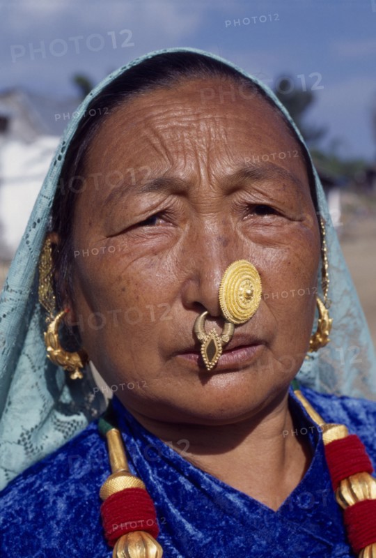 NEPAL, East, Sokropati, Limbuni woman tribeswearing traditional gold Limbu nose jewellery