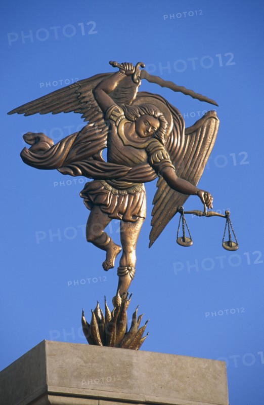 EGYPT, Nile Valley, Aswan, Coptic Cathedral.  Statue of the Archangel Michael holding sword and scales.