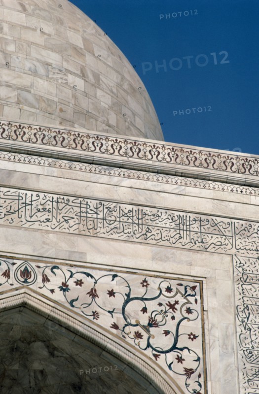 INDIA, Uttar Pradesh, Agra, Detail of semi precious stones inlaid in white marble with Arabic script quoting from the Koran on the Taj Mahal