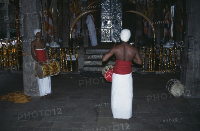 SRI LANKA, Kandy, Temple of the Tooth interior with drummers