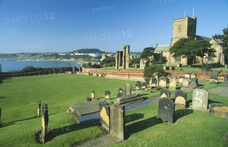ENGLAND, Yorkshire, Scarborough, Grave of Anne Bronte in a graveyard at St Marys Church overlooking the coast