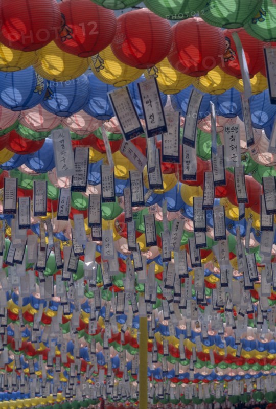SOUTH KOREA, Seoul, Jogyesa Temple.  Canopy of paper lanterns and prayer streamers hung to celebrate the birthday of Buddha.