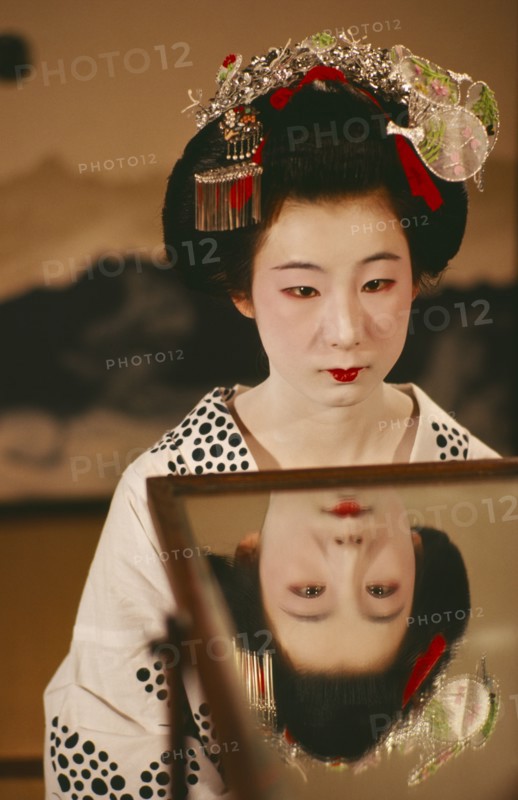 JAPAN, Kyoto, Portrait of a Geisha girl with reflection in a mirror