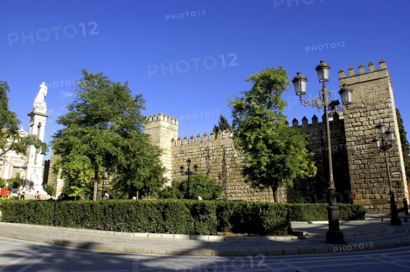 SPAIN, Andalucia, Seville, Crenellated exterior wall of the Royal Alcazar