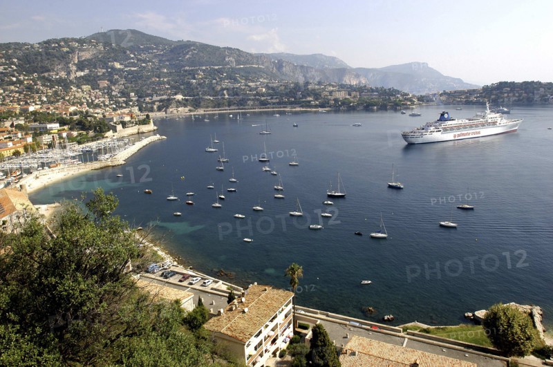 FRANCE, Cote d Azur, View over bay between Nice and Monte Carlo with moored Cruise ship and smaller boats