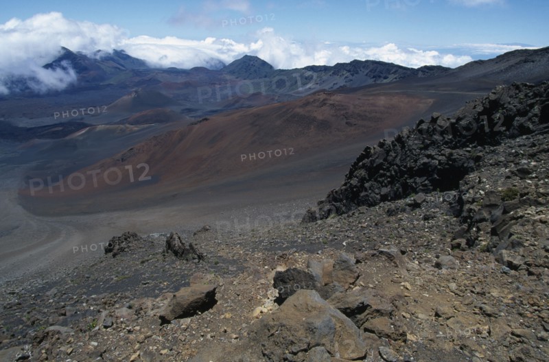 USA, Hawaii, Maui, Cinder cones and iron rich lava weathered to brown oxide in the vast crater of Haleakala Volcano