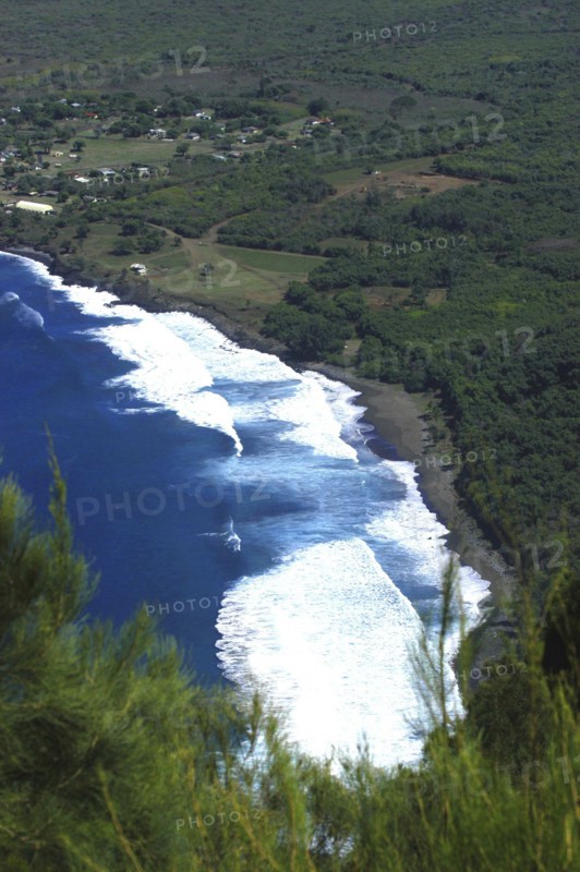 USA, Hawaii, Molokai, Kalaupapa. Aerial view looking down on bay and green coastline