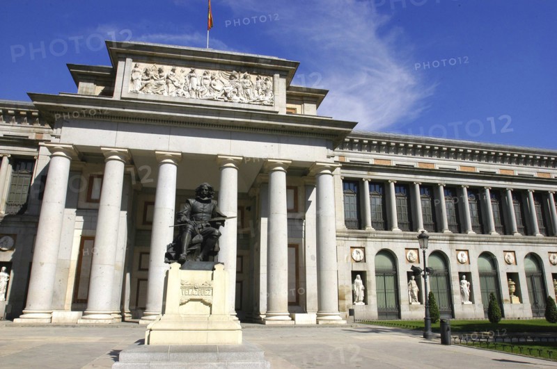 SPAIN, Madrid, Prado Museum columned entrance with statue outside