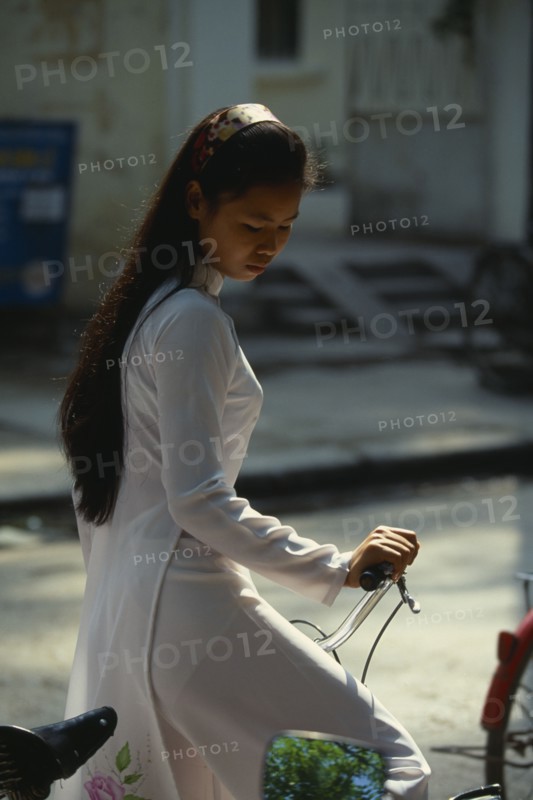 VIETNAM, North, Hanoi, College girl wearing traditional Ao Dai.