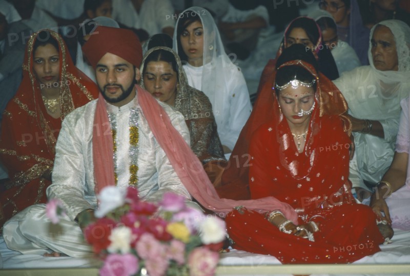 WEDDING, Sikh, Bride and groom at Sikh wedding ceremony.