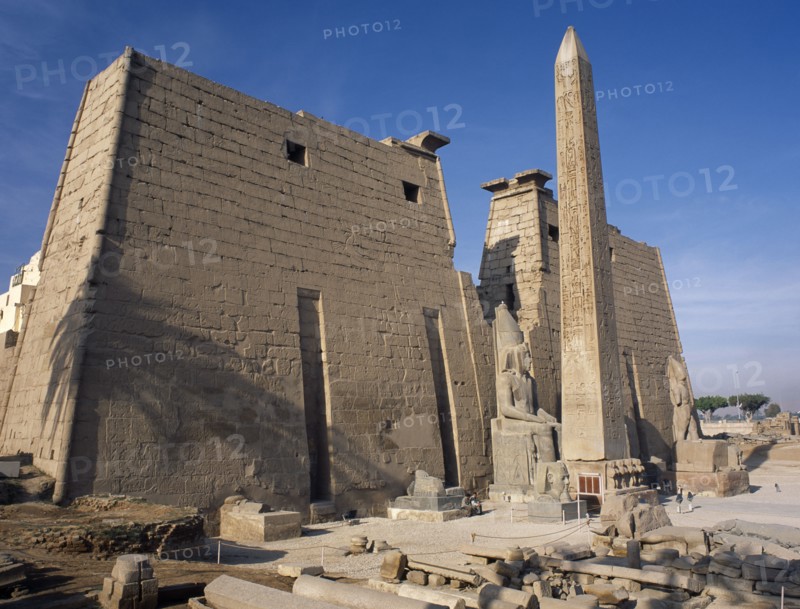 EGYPT, Nile Valley, Luxor, Luxor Temple. Obelisk and statue of Ramses II