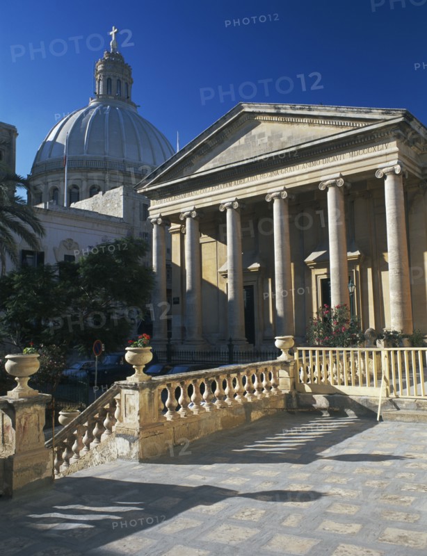 MALTA, Valletta, St Pauls Anglian Cathedral with Dome of carmelite Church behind.