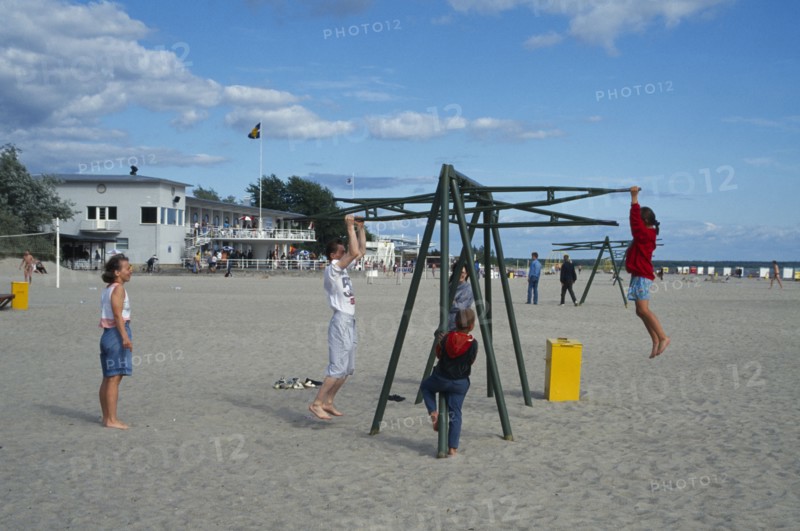 ESTONIA, Parnu, Children playing on the beach.