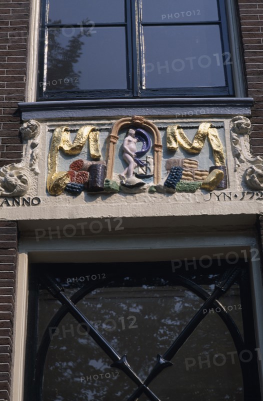 HOLLAND, Noord, Amsterdam, Close up detail of a wall tablet used before house numbers were added
