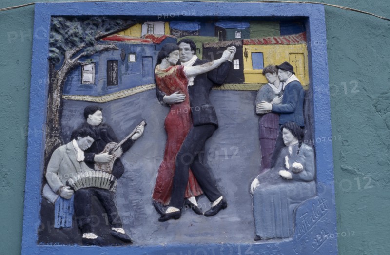 ARGENTINA, Buenos Aires, La Boca.  Painted tableau of tango dancers in the old port district.