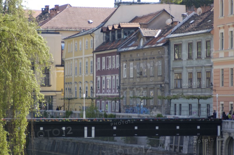 SLOVENIA, Ljubljana, River Ljubljanica. View along row of Austro Hungarian buildings toward the Old Town