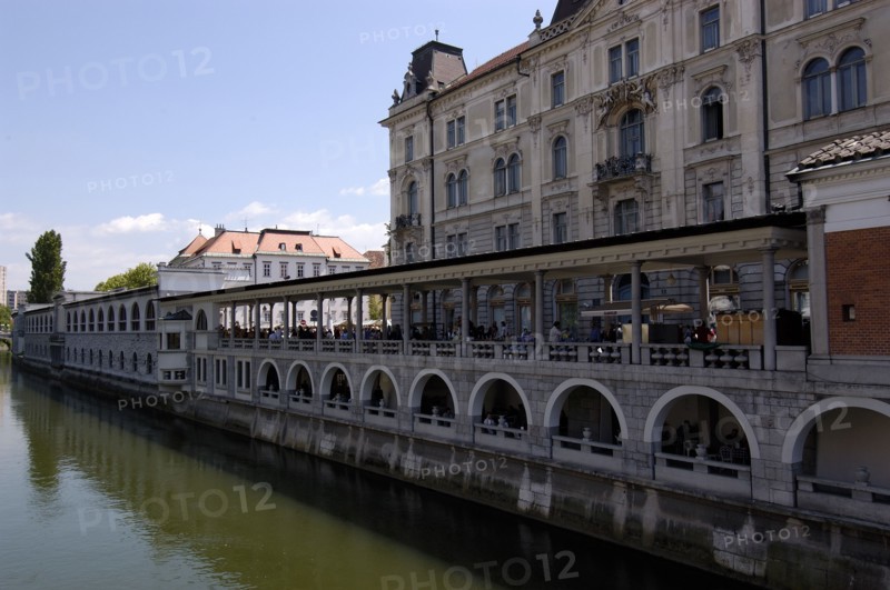 SLOVENIA, Ljubljana, River Ljubljanica. View along embankment and colonnade designed by Joze Plecnik