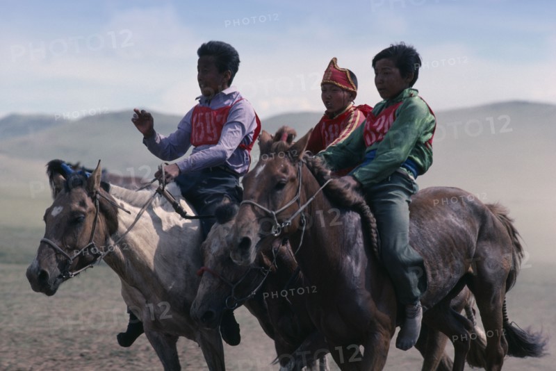 MONGOLIA, Horses, National Day horse race with boy jockeys on horseback