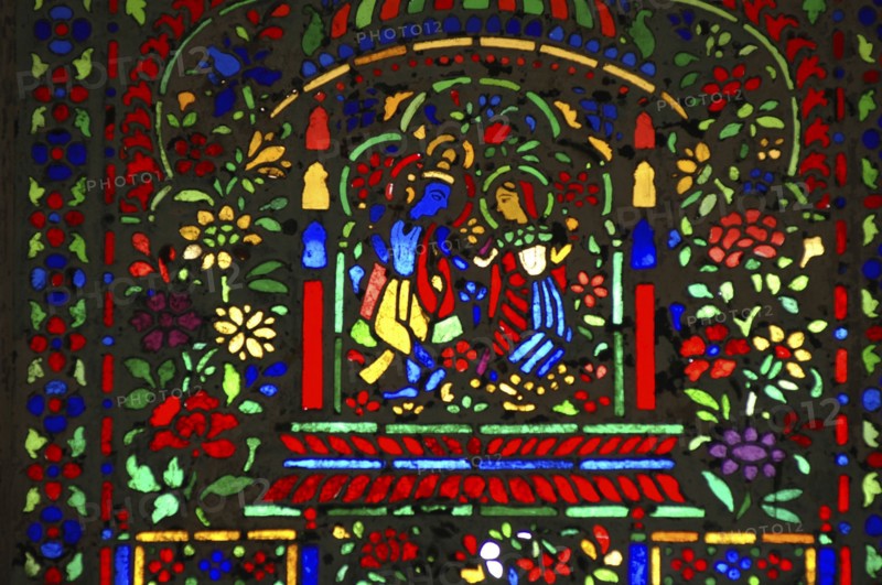 INDIA, Rajasthan, Jaipur, Colourful stained glass window in the Maharaja Man Singh Amber palace