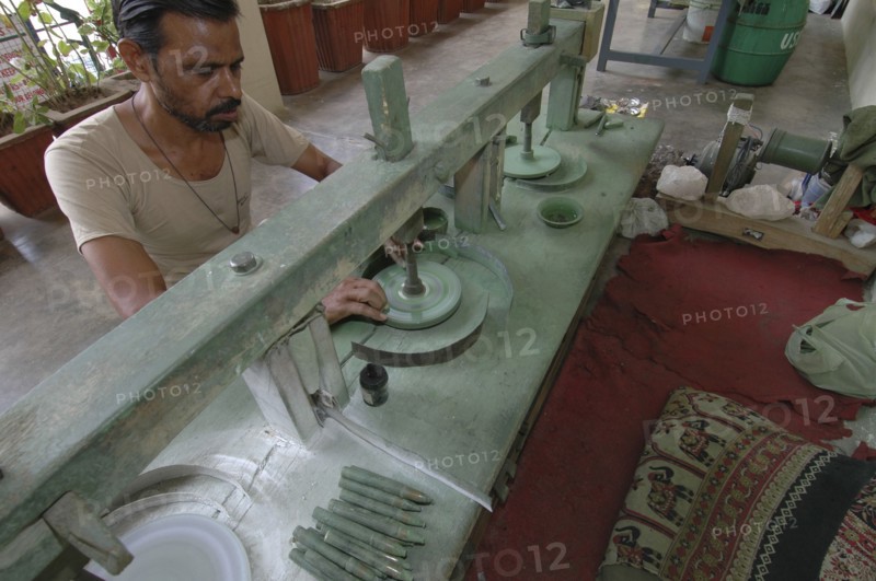 INDIA, Rajasthan, Jaipur, Man polishing precious stones