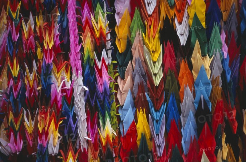 JAPAN, Honshu, Hiroshima, Peace Memorial Park. Mass of multi coloured origami cranes at the Childrens Peace Monument