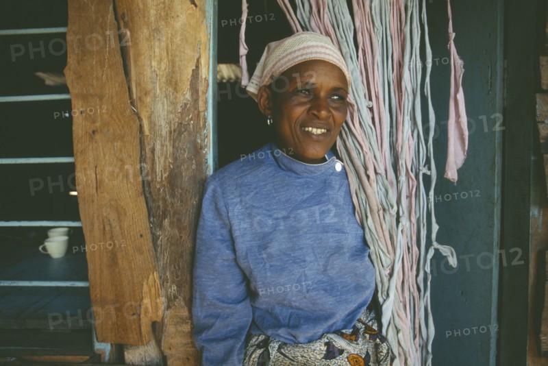 TANZANIA, Arusha, Portrait of smiling woman at Kisongo Masai market outside Arusha.