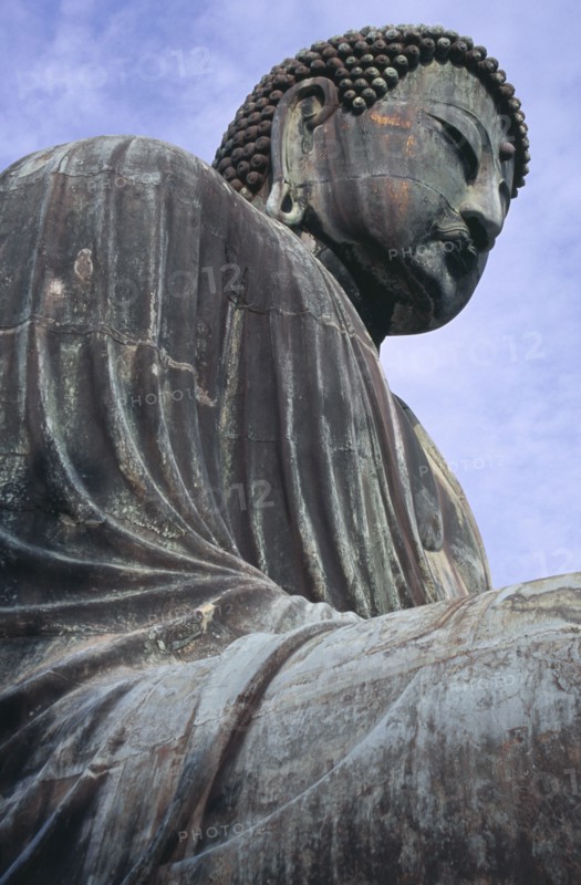JAPAN, Honshu, Kamakura, Angled view looking up at the Daibutsu aka Great Buddha statue dating from 1252