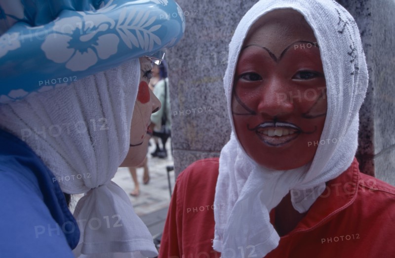 JAPAN, Honshu, Tokyo, Harajuku District. Portrait of two young teenage girls wearing theatrical face makeup