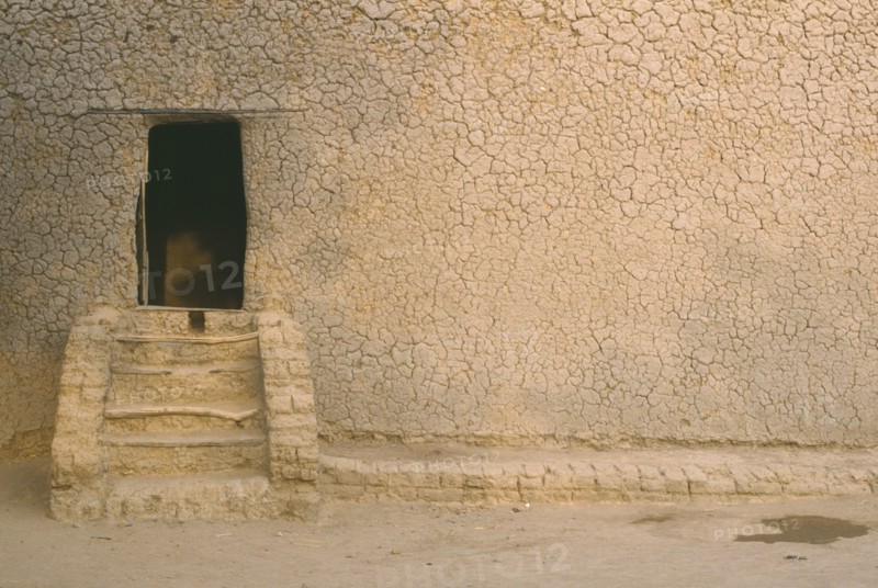 MALI, Djenne, "Mud house, exterior detail with steps leading to doorway"